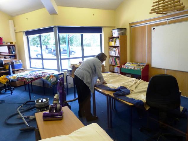 Mrs Woollven's mum hoovering curtains